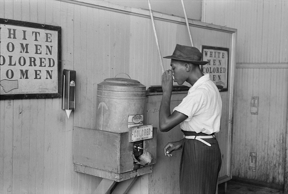A person of color at ‘Colored’ water cooler in Oklahoma City, 1939