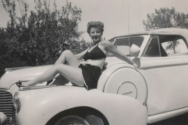 1940 Buick with bathing beauty