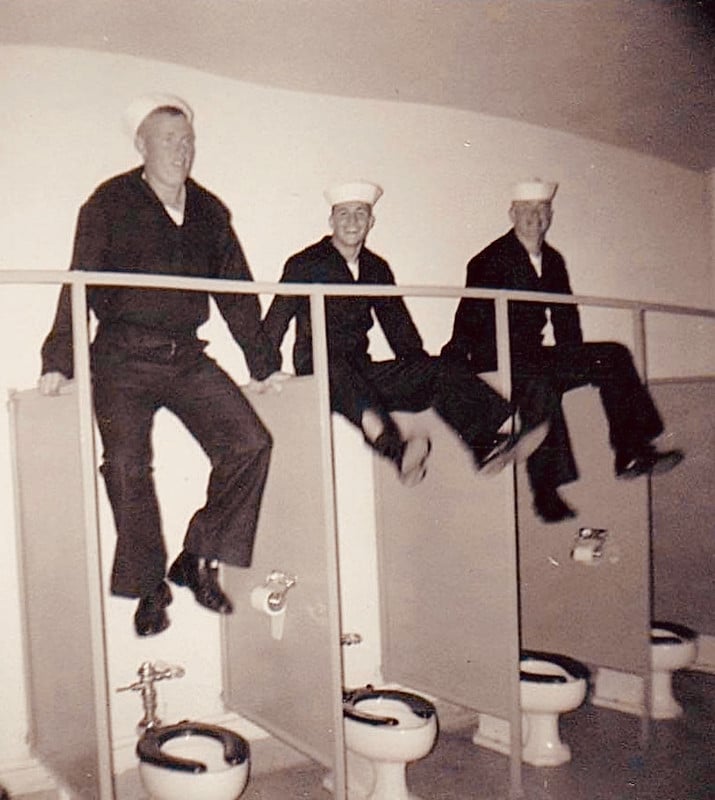 Navy sailors doing toilet acrobatics