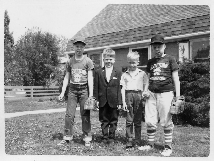 Brothers in front of Levittown home, 1968