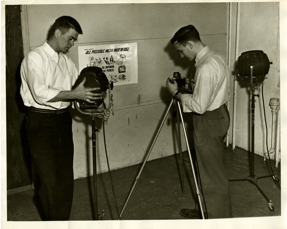 Students photographing civil defense posters, Boston, 1952