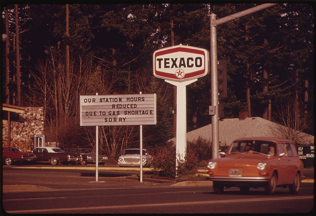 Fuel Shortage In The Pacific Northwest Resulted In A Sign About Shorter Hours Like This At A Gasoline Station At Oak Grove Oregon. Most Stations Reduced Their Hours And Closed On Sundays (December 1973)