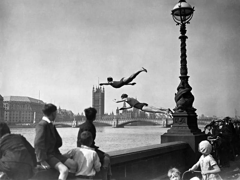 Crowd watching divers plunge into the River Thames, London 1930s