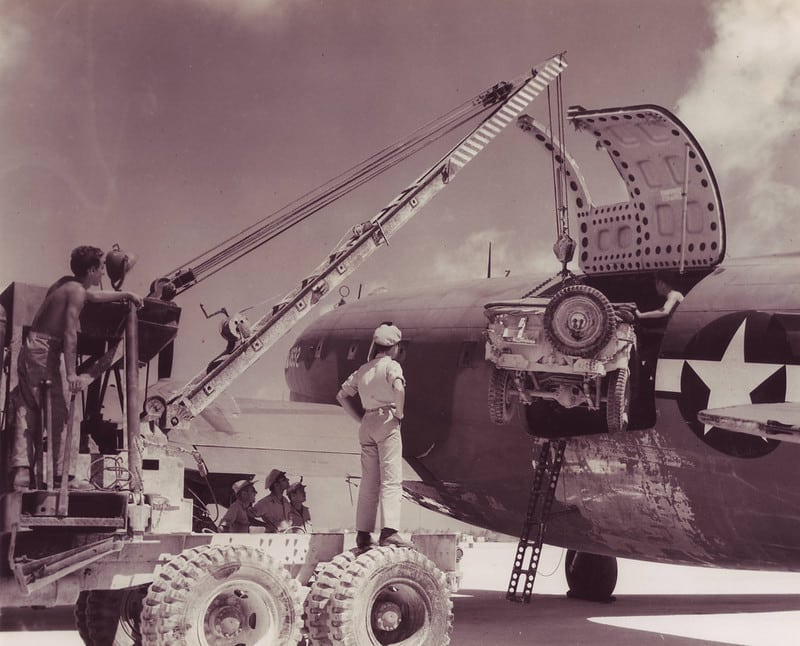 WWII Pacific Theatre Jeep loading Curtiss Commando