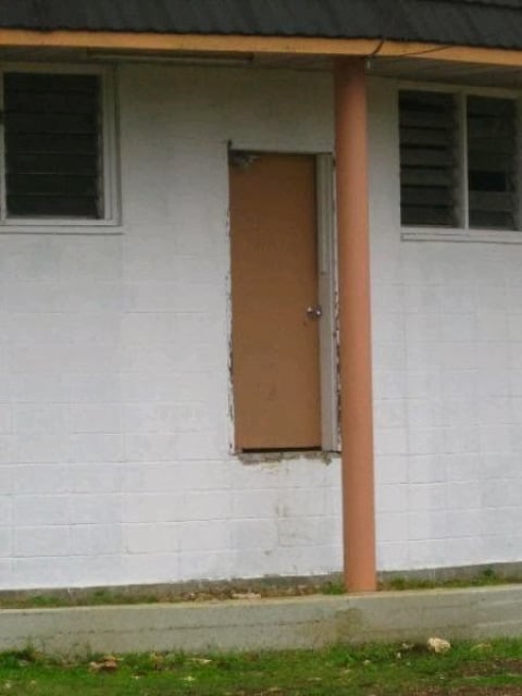 Door with pole in front and weird elevation