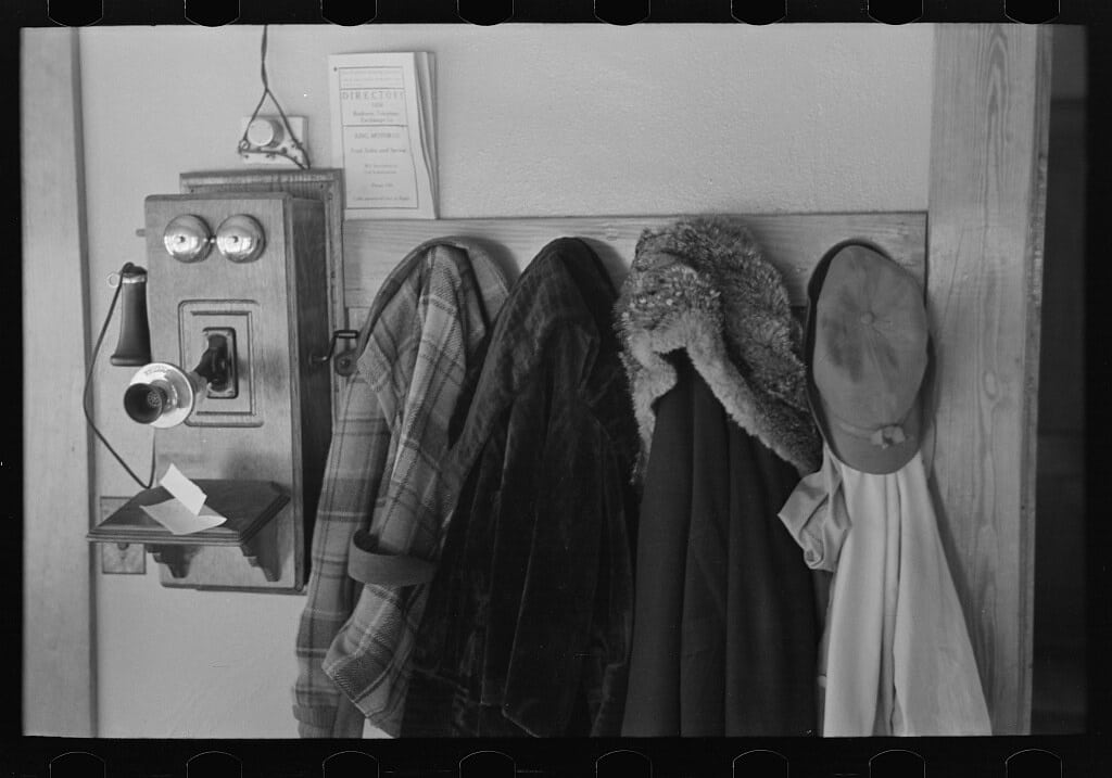 Garments hanging near telephone in Rustan brothers' farm