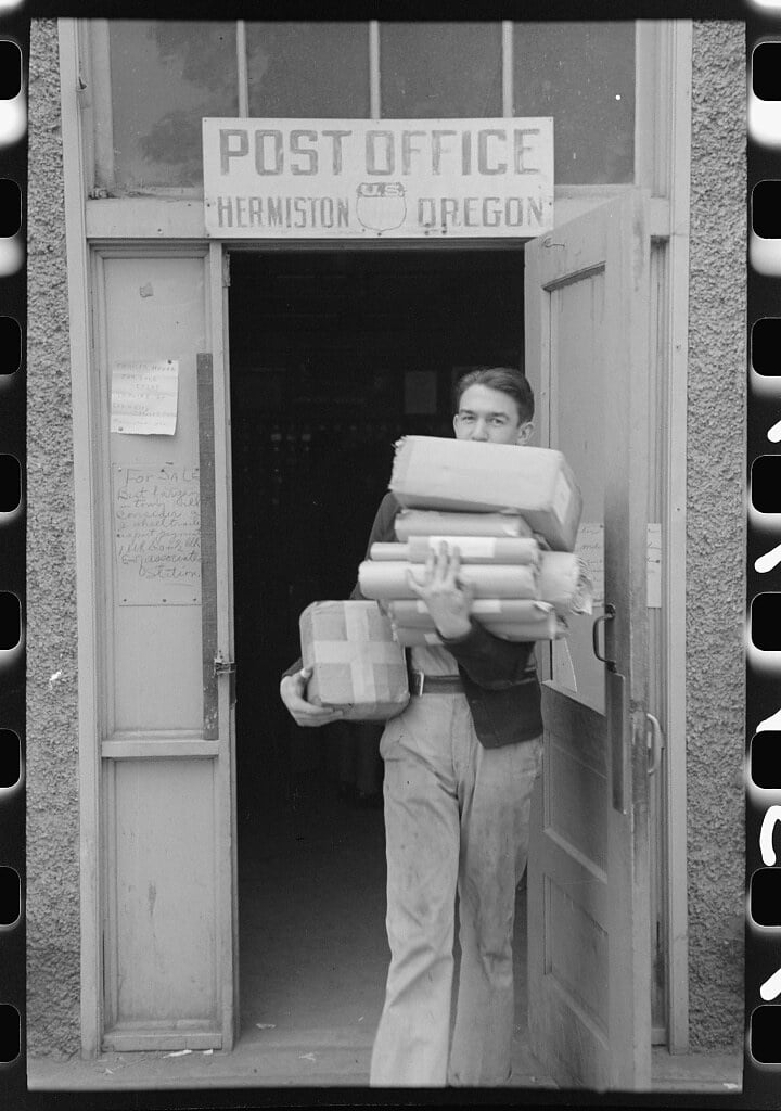 Coming out of post office at Hermiston, Oregon (1941 Sept.)