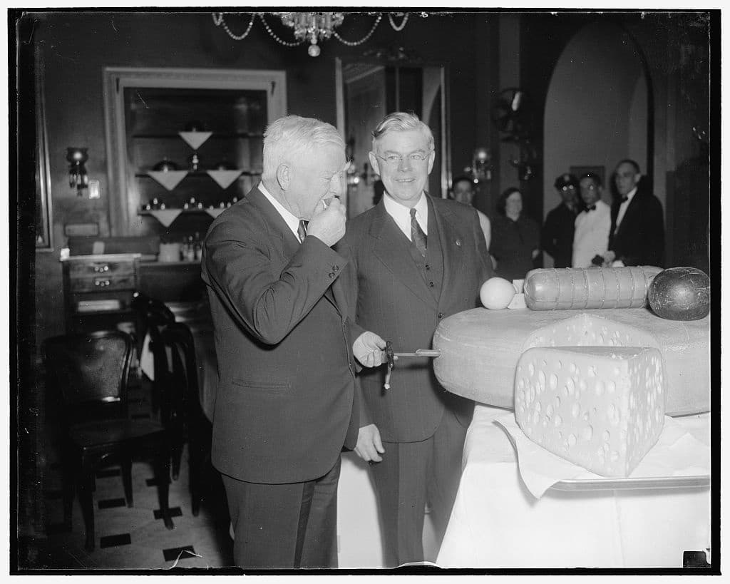 Wisconsin cheese. V.P. Garner & Sen. F. Ryan Duffy of Wisc. tasting cheese (1938 March 5)