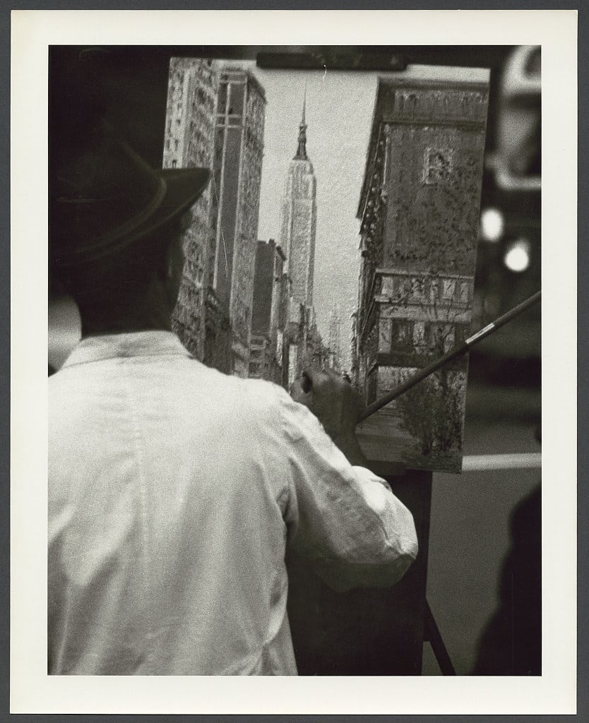 Artist painting New York cityscape