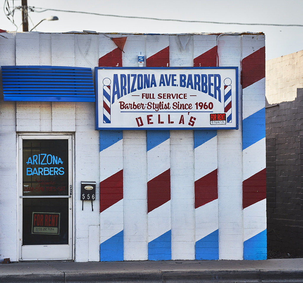 Barber-pole decorations on a barber shop in Chandler, Arizona, a southern suburb of Phoenix, Arizona since 1960 (2018-11-18)