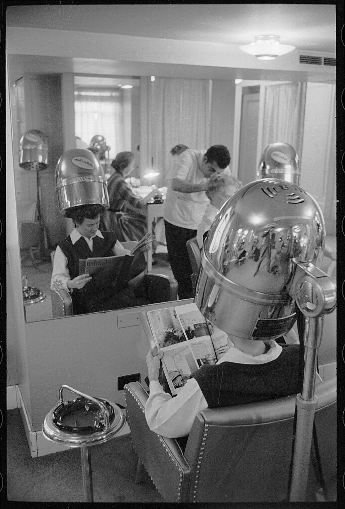 Beauty Parlor, Washington, D.C.- Warren K. Leffler appears in reflection (1957 November 20)