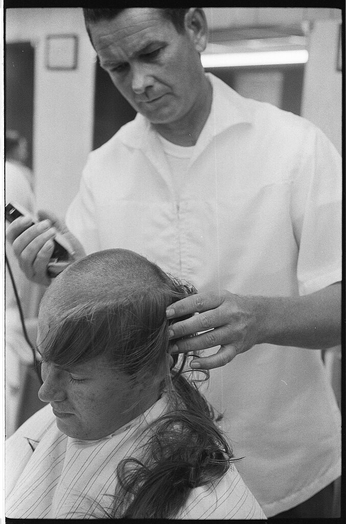 New U.S. Army draft recruit getting his hair cut by a barber (May 15 1967)