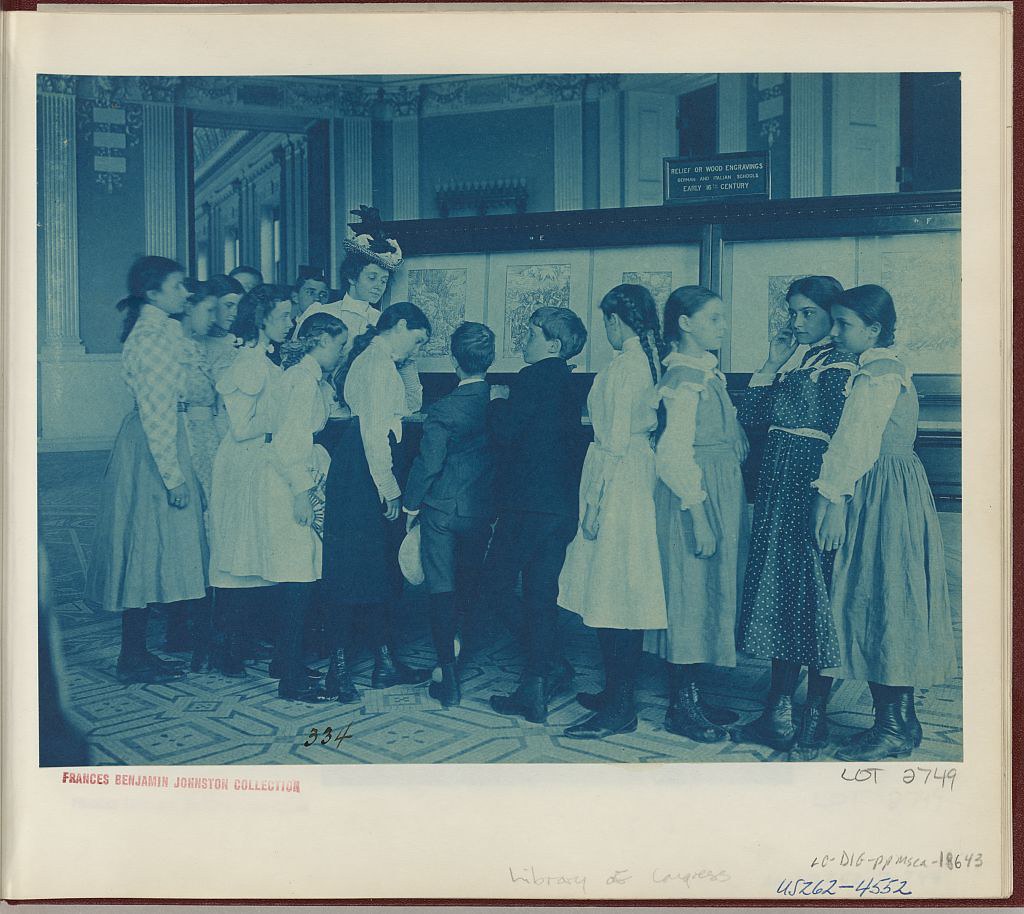 Students from 6th Division public schools, Washington, D.C., looking at an exhibit of fine prints in the Library of Congress (1899)