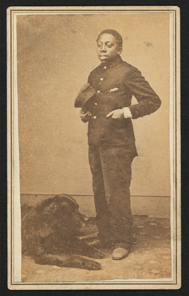Full-length portrait of an African American boy with a dog (between 1860 and 1870)