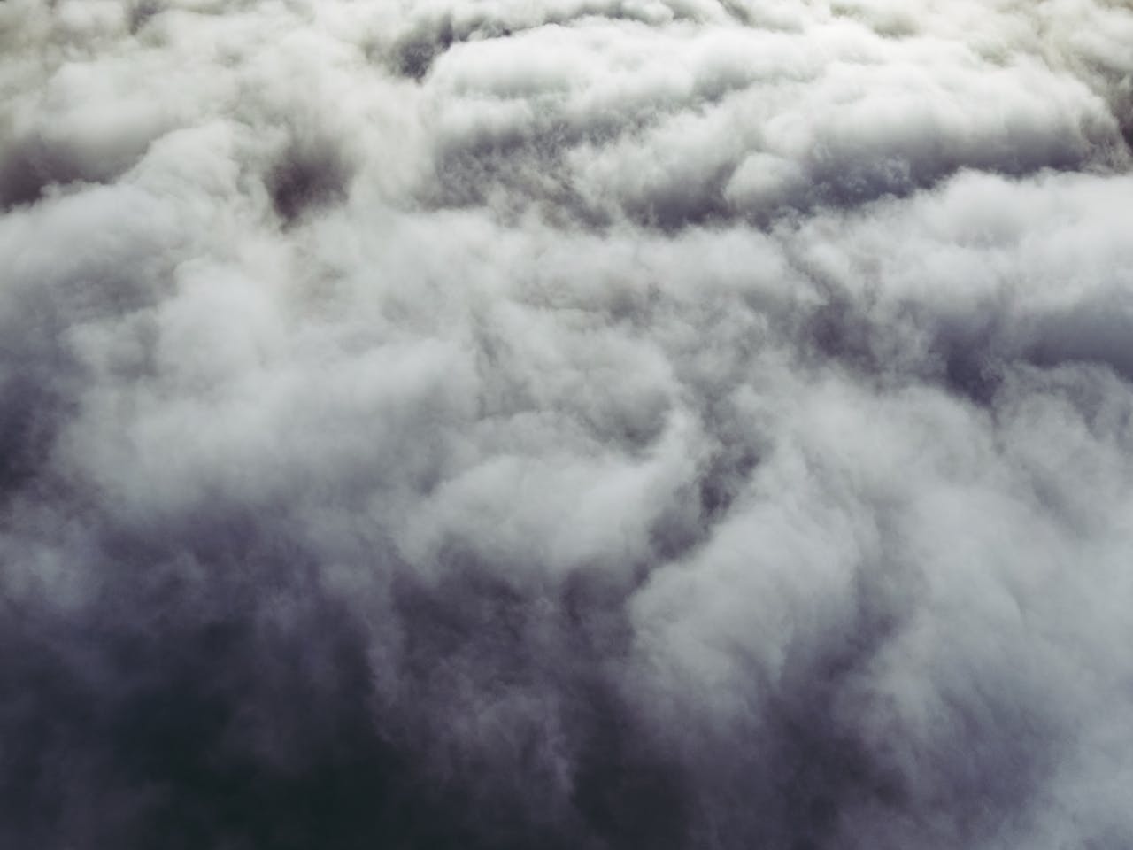 White dense clouds above highlands.