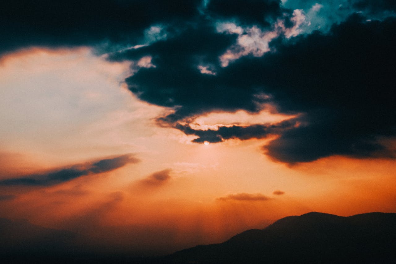 Clouds silhouetted on a vivid sunset sky.