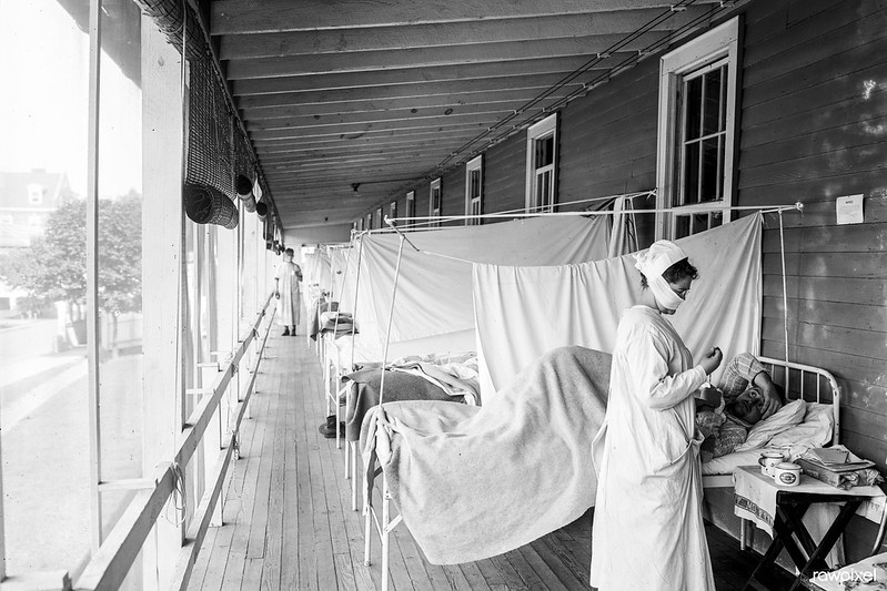Walter Reed Hospital flu ward (ca. 1910-1920). Original from Library of Congress. Historical photographs captured during the Flu pandemic including patient images, medical treatment, hospital, and Red Cross volunteer team