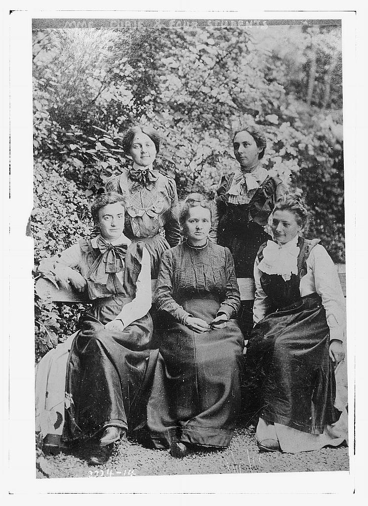 Marie Curie-Skłodowska with four students