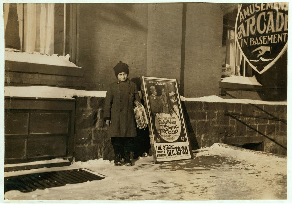 Young newspaper seller in Vermont