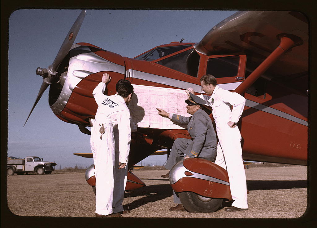 Instructor and students studying a map, Meacham Field, Fort Worth, Tex. (1942 Jan.)