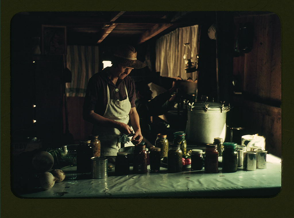 Wife of Jim Norris with canned goods, Pie Town, New Mexico (1940 Oct.)