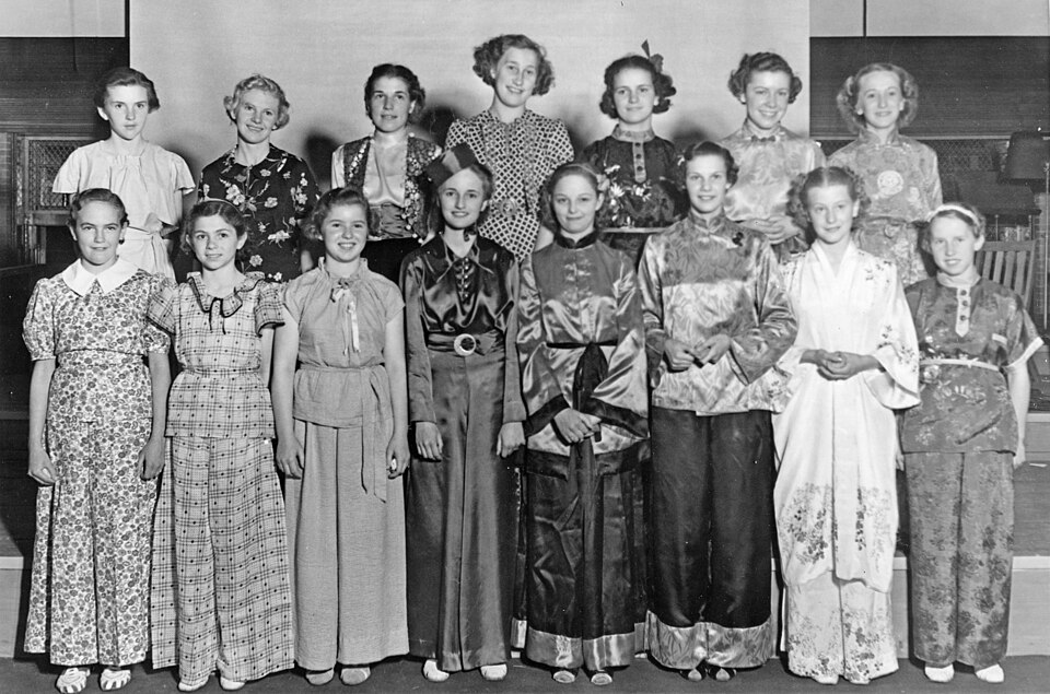 annual girls' pajama party at 4-H club summer school at Oregon State this year these were the tops. Because there are so many girls this year several separate parties were held. Each of the dormitories had a party and the 'sorority girls' held several, with two or three houses combining for each. A more casual costume party. Circa 1940