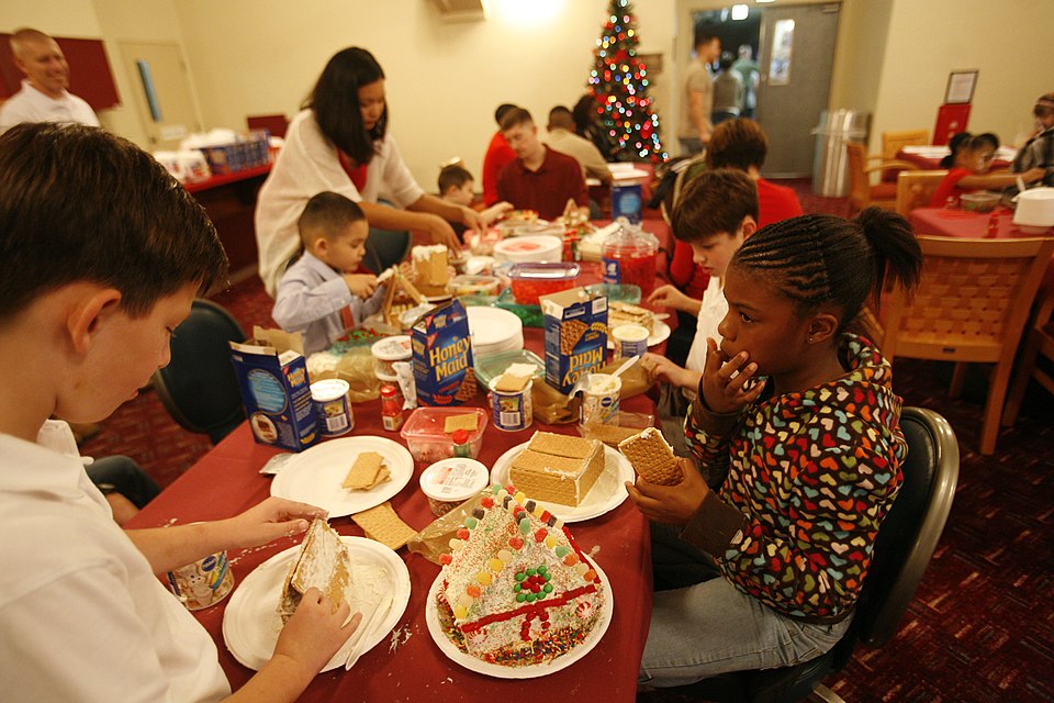 Children created gingerbread houses at the 3rd Maintenance Battalion’s Christmas Party held at the Kinser Surfside Dec. 13. Other activities the children participated in were paper crafts, an inflatable bounce house, face painting, movies and a chance to sit with Santa. 13 December 2011