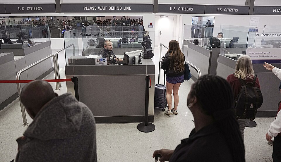 Passenger wears shorts and sneakers, Baltimore-Washington 2025