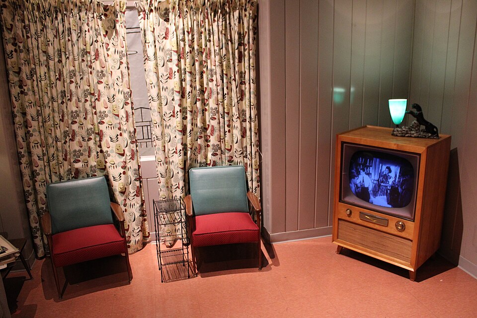 50s style living room with operating black and white television