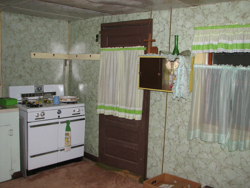 these are pictures of the circa 1969 dance hall kitchen. Check the oven! The curtains! The mint green marble linoleum walls!