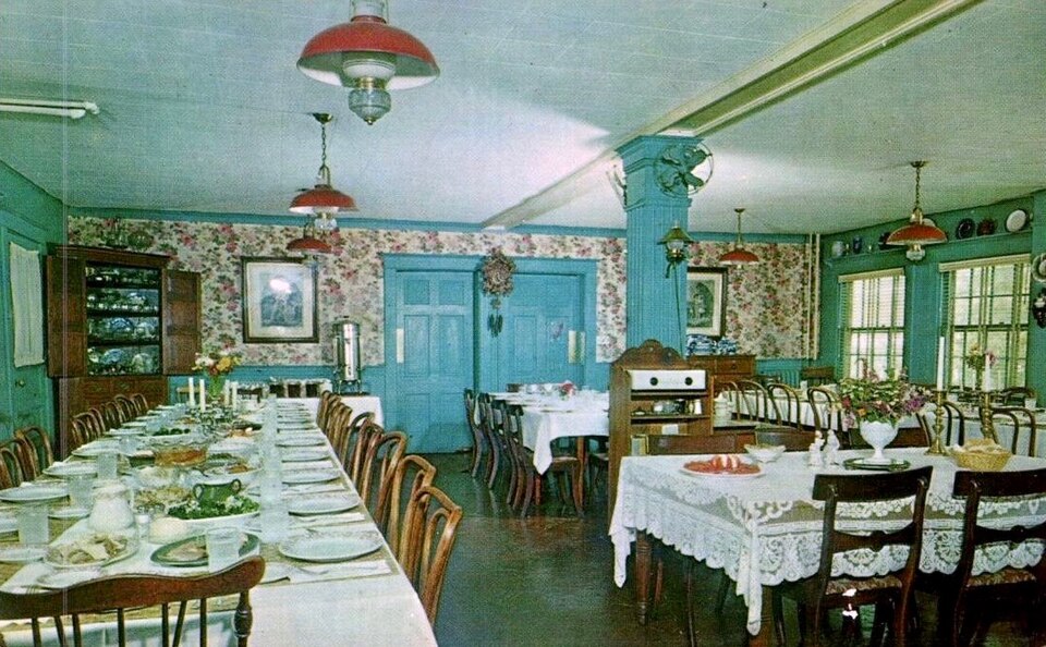 Nu-Wray Inn , Burnsville North Carolina, Dining Room. Circa 1950s. Notice the floral wallpaper, the elaborate chair designs, and the bright walls.