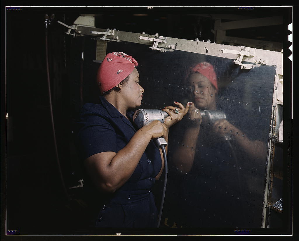 Woman at Vultee-Nashville factory using a hand drill