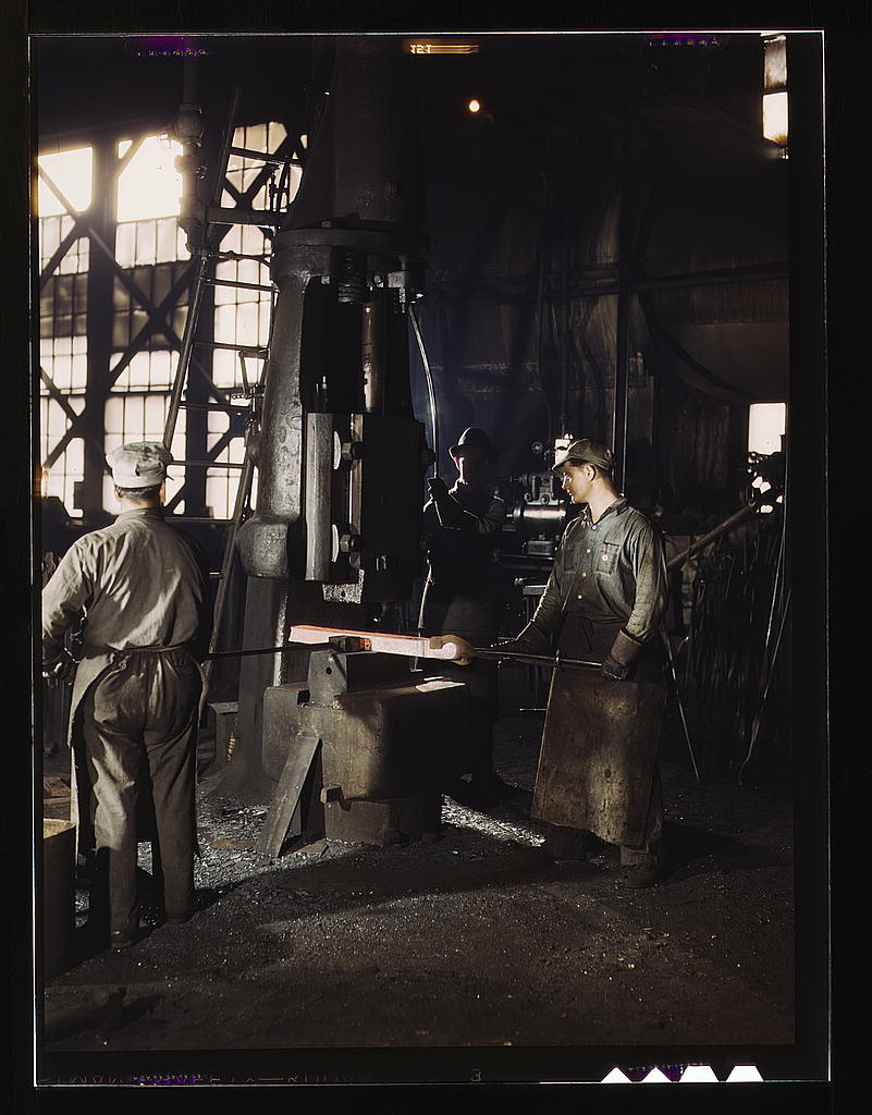 Working with a small steam drop hammer at the blacksmith shop in the Santa Fe R.R. shops, Topeka, Kansas (1943 March)