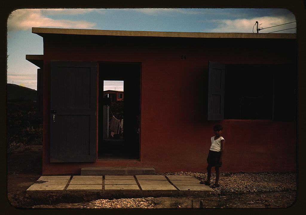 Child of an FSA - R.R. borrower in front of their house, Puerto Rico (1941 Dec. or 1942 Jan.)