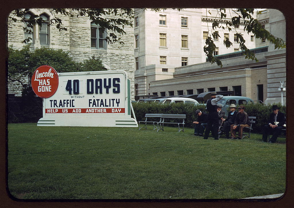 Park in Lincoln, Nebraska — Photograph shows Park and billboard: Lincoln has gone 40 Days without a Traffic Fatality, help us add another day. (1942)