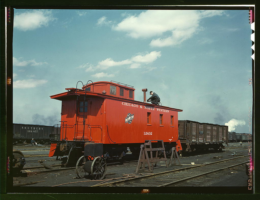 C & NW RR, putting the finishing touches on a rebuilt caboose at the rip tracks at Proviso yard, Chicago, Ill. (1943 April)