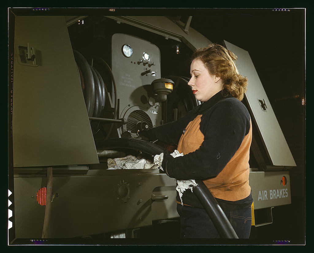 Agnes Cliemka, age 23, married and husband may be going into the service any day, Heil and Co., Milwaukee, Wisconsin. Agnes used to work in a department store. Checking of gasoline hose of gasoline trailers before being turned over the Air Force (1943 Feb.)