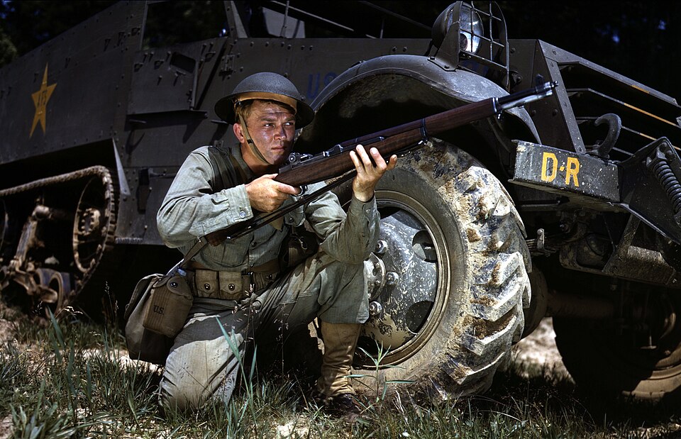 WWII Infantryman kneeling with M1 Garand