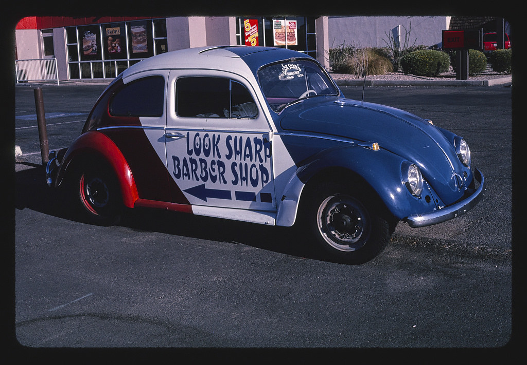 Look Sharp Barber Shop sign (painted 1969 Volkswagen), Yuma, Arizona (2003)