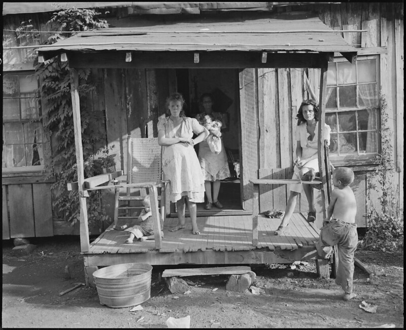 Miners' wives and children on porch, Belva Mine, Kentucky.