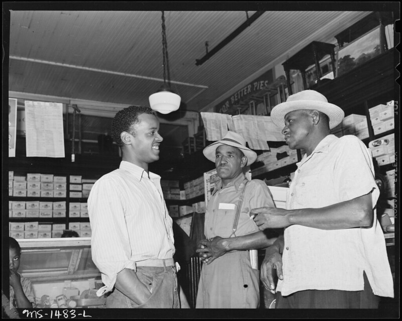 James Robert Howard and miners at company store.