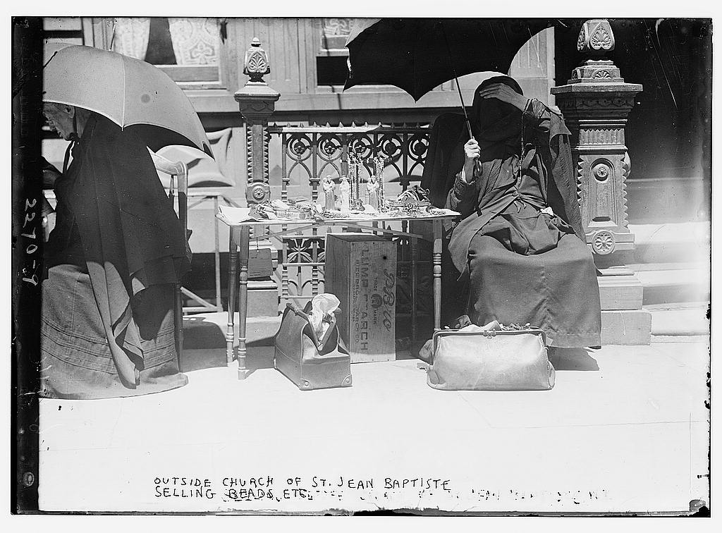 Outside church of St. Jean Baptiste, selling beads, etc.