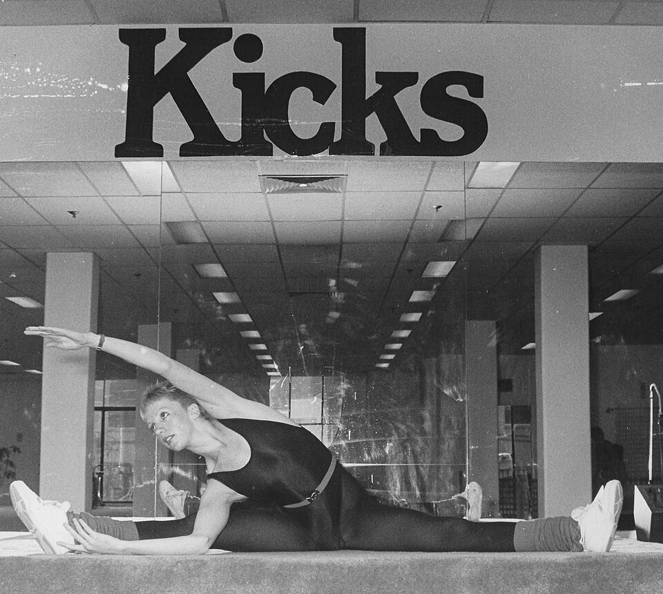 Aerobics instructor on teaching platform, 1980s