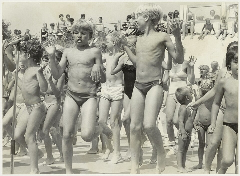Youth aerobic dancing on beach, 1983–1985